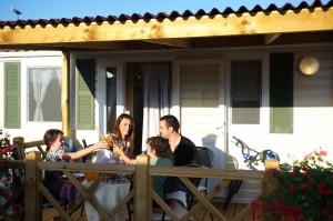 Dad wife and kid in front of mobile home